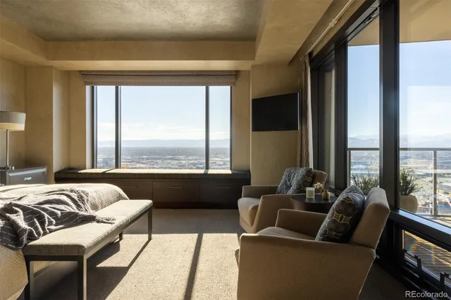 a bedroom with a bed and a couch