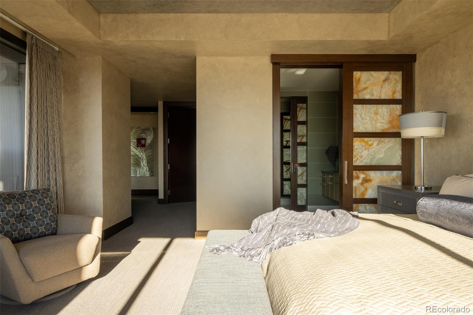 1133 14th Street, Unit 2900 Denver, CO 80202 - Photo 20 of 48 a bedroom with a bed and a couch