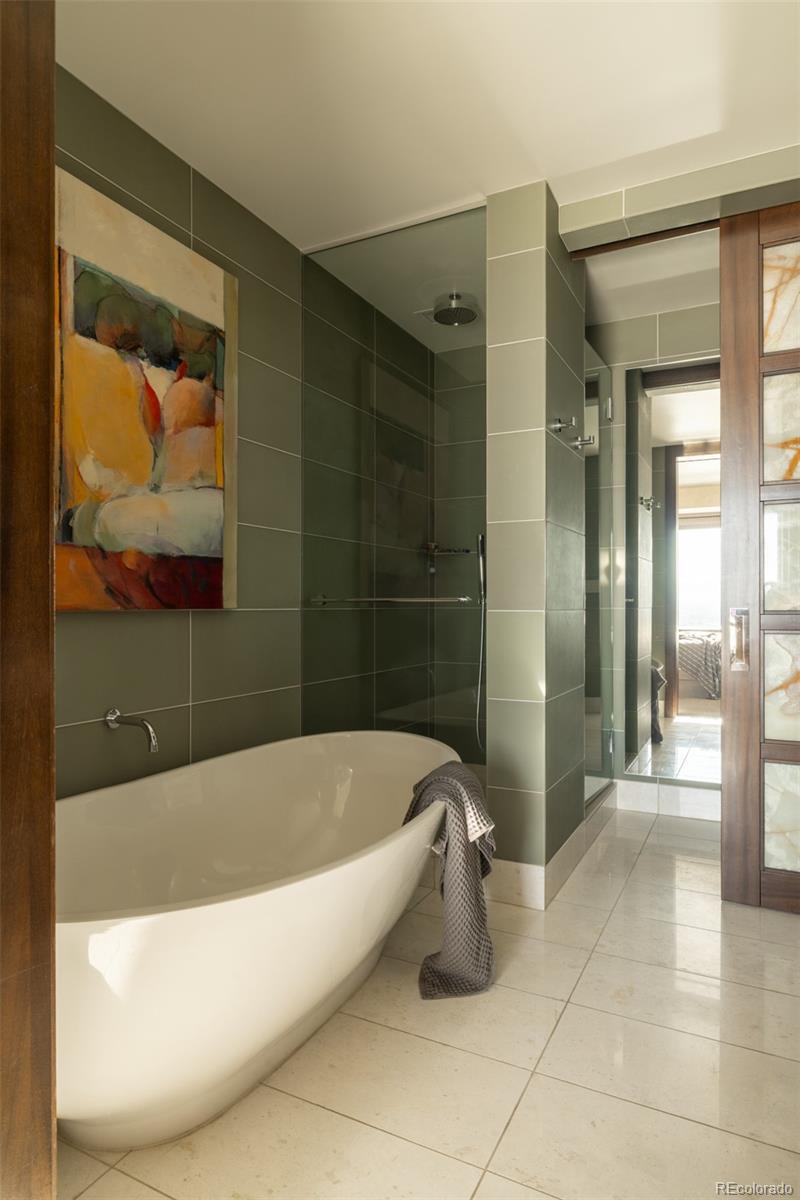 1133 14th Street, Unit 2900 Denver, CO 80202 - Photo 22 of 48 a bath tub sitting next to a bathroom