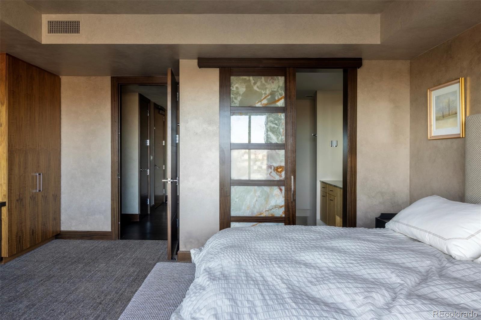 1133 14th Street, Unit 2900 Denver, CO 80202 - Photo 29 of 48 a bedroom with a bed and a window