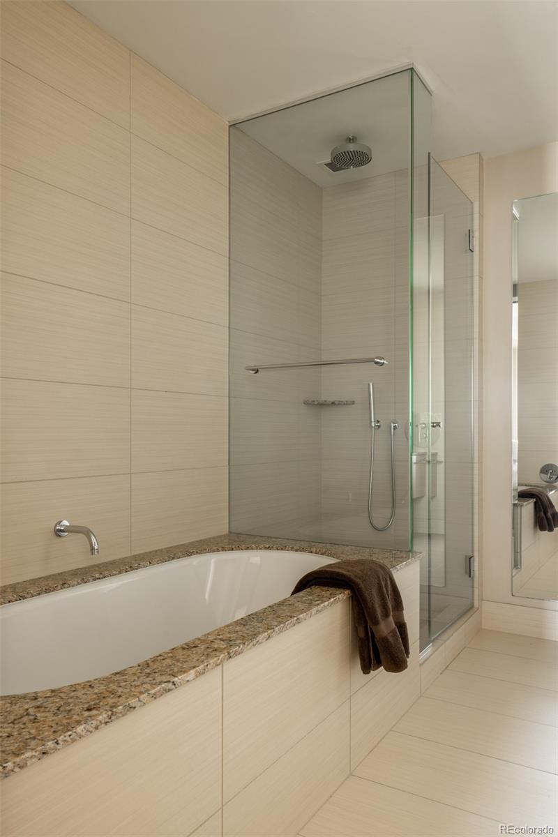 1133 14th Street, Unit 2900 Denver, CO 80202 - Photo 32 of 48 a bathroom with a bathtub and a shower