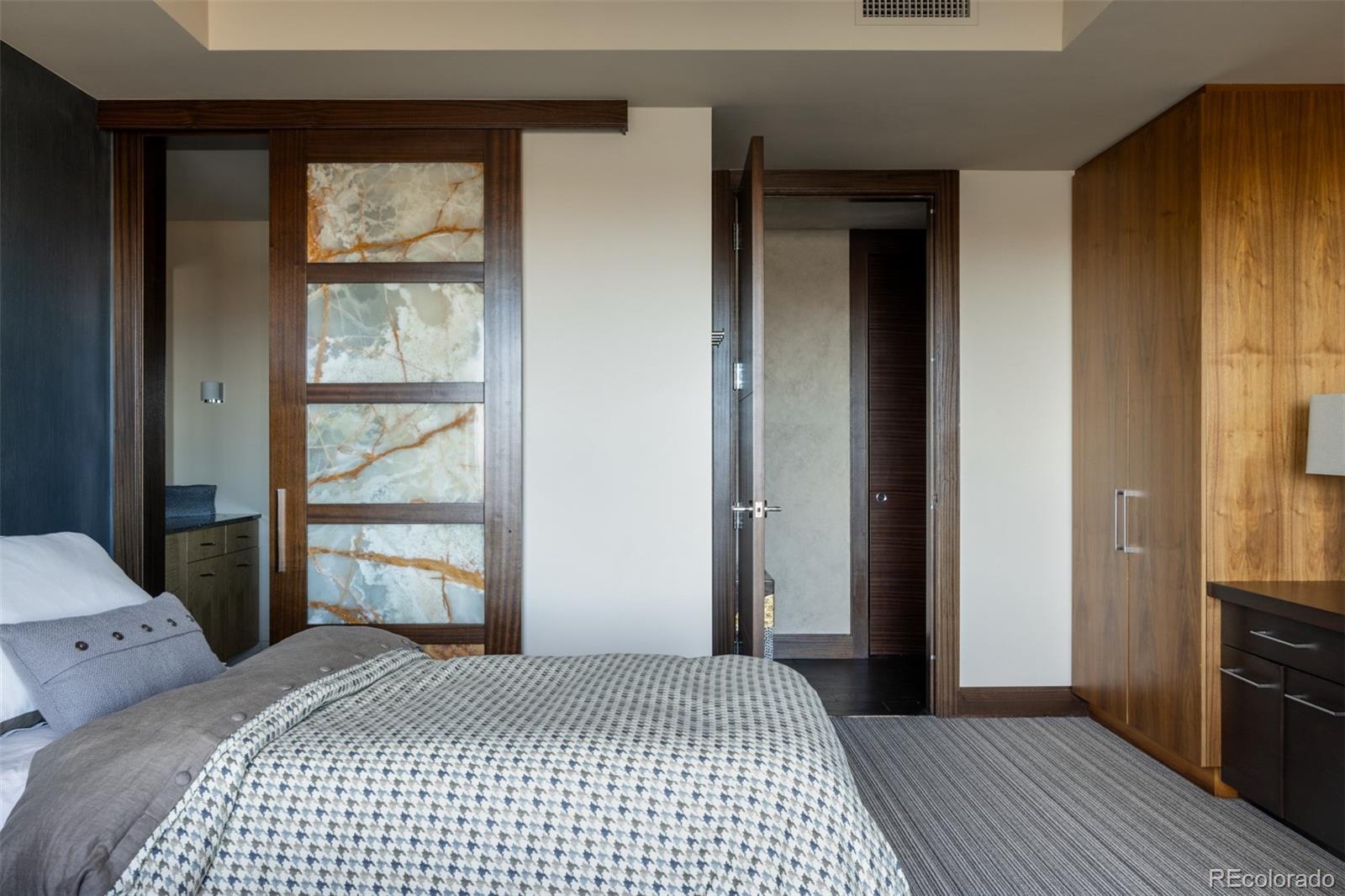 1133 14th Street, Unit 2900 Denver, CO 80202 - Photo 35 of 48 a bedroom with a bed and a window