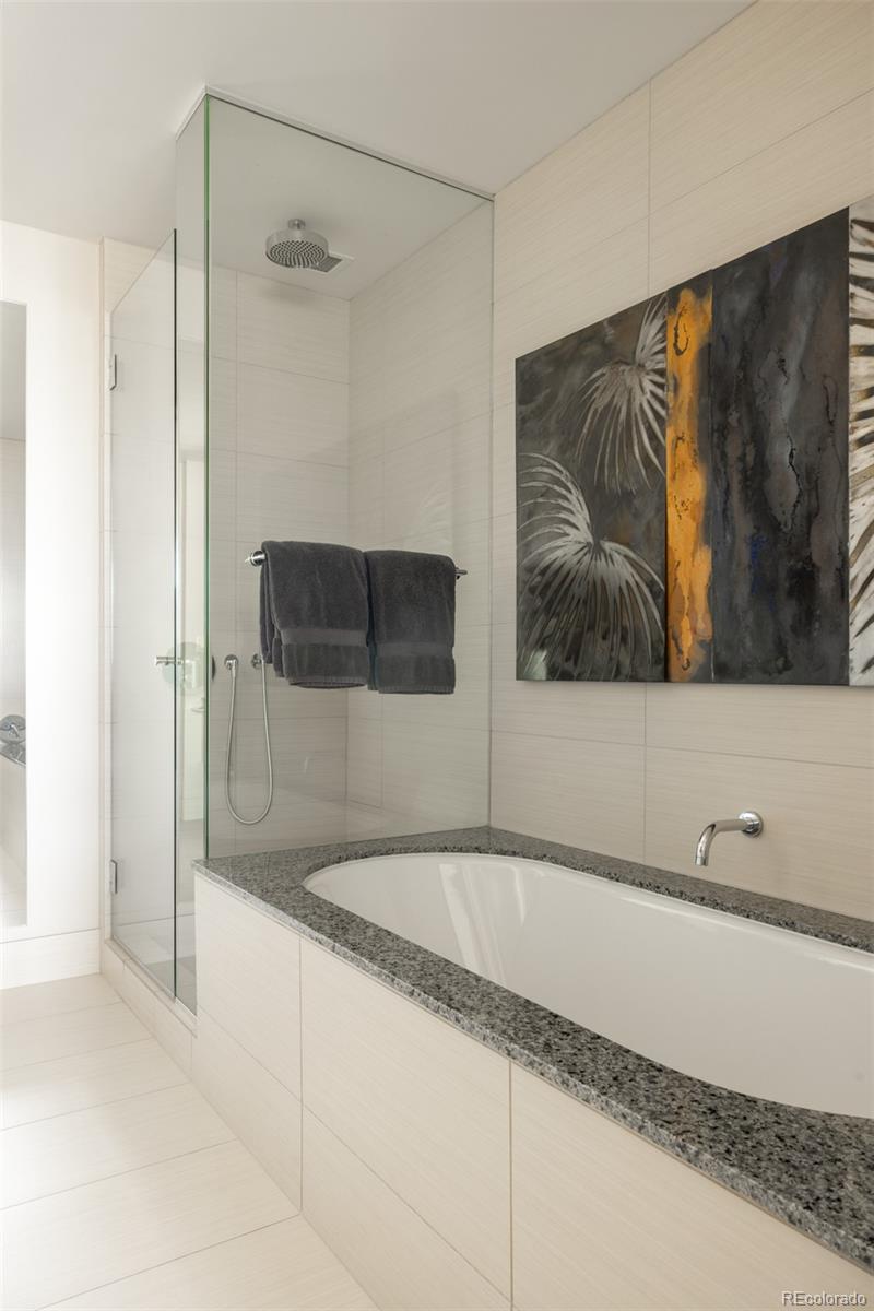 1133 14th Street, Unit 2900 Denver, CO 80202 - Photo 37 of 48 a bathroom with a tub and shower