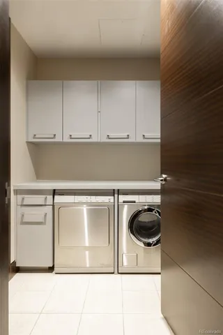 a dining table with chairs and window