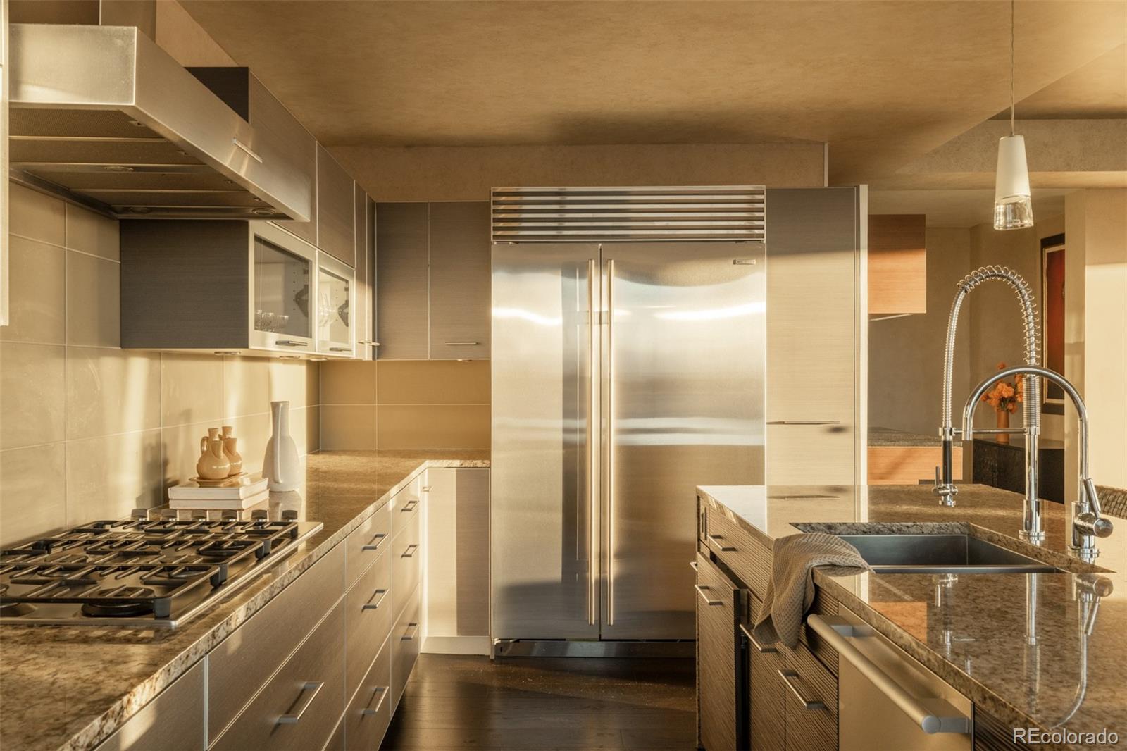1133 14th Street, Unit 2900 Denver, CO 80202 - Photo 10 of 48 a kitchen with a refrigerator and a sink