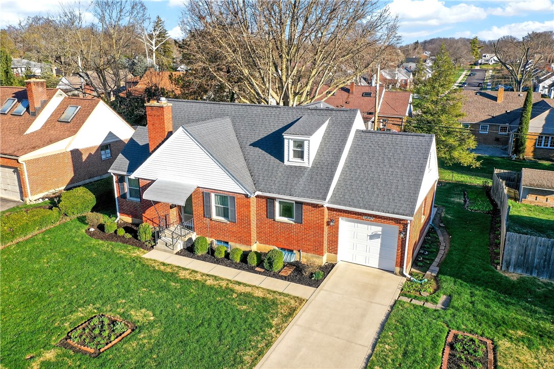 1237 Laurelwood Road Dayton, OH 45409 - Photo 46 of 56 This charming residence showcases a classic brick exterior, inviting landscaping, and convenient attached garage.