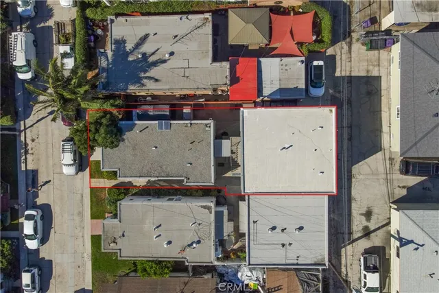 an aerial view of residential houses with outdoor space