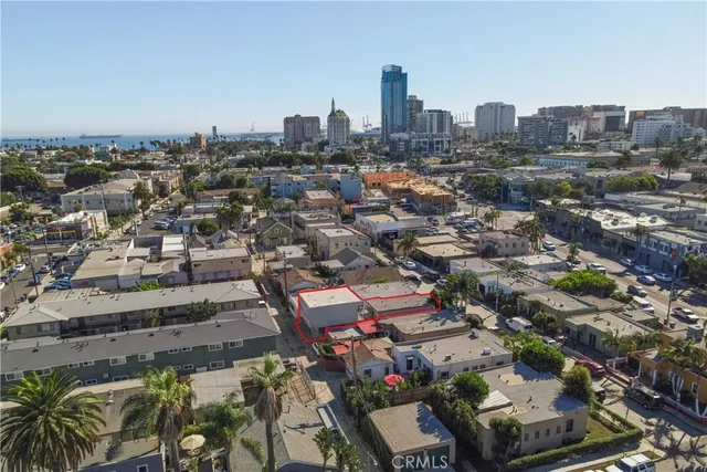 an aerial view of a house with garden space and street view
