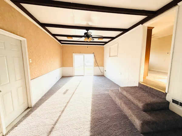 a view of staircase with a rug