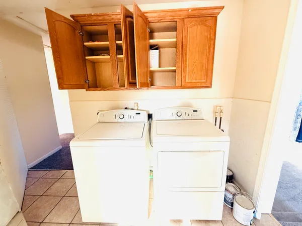a utility room with dryer and washer