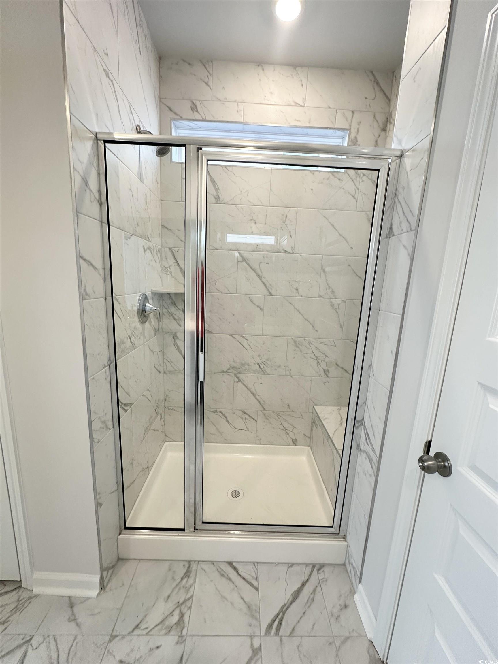 285 Augusta Grn Way Myrtle Beach, SC 29579 - Photo 11 of 28 Full bathroom with a marble finish shower and light marble finish floors