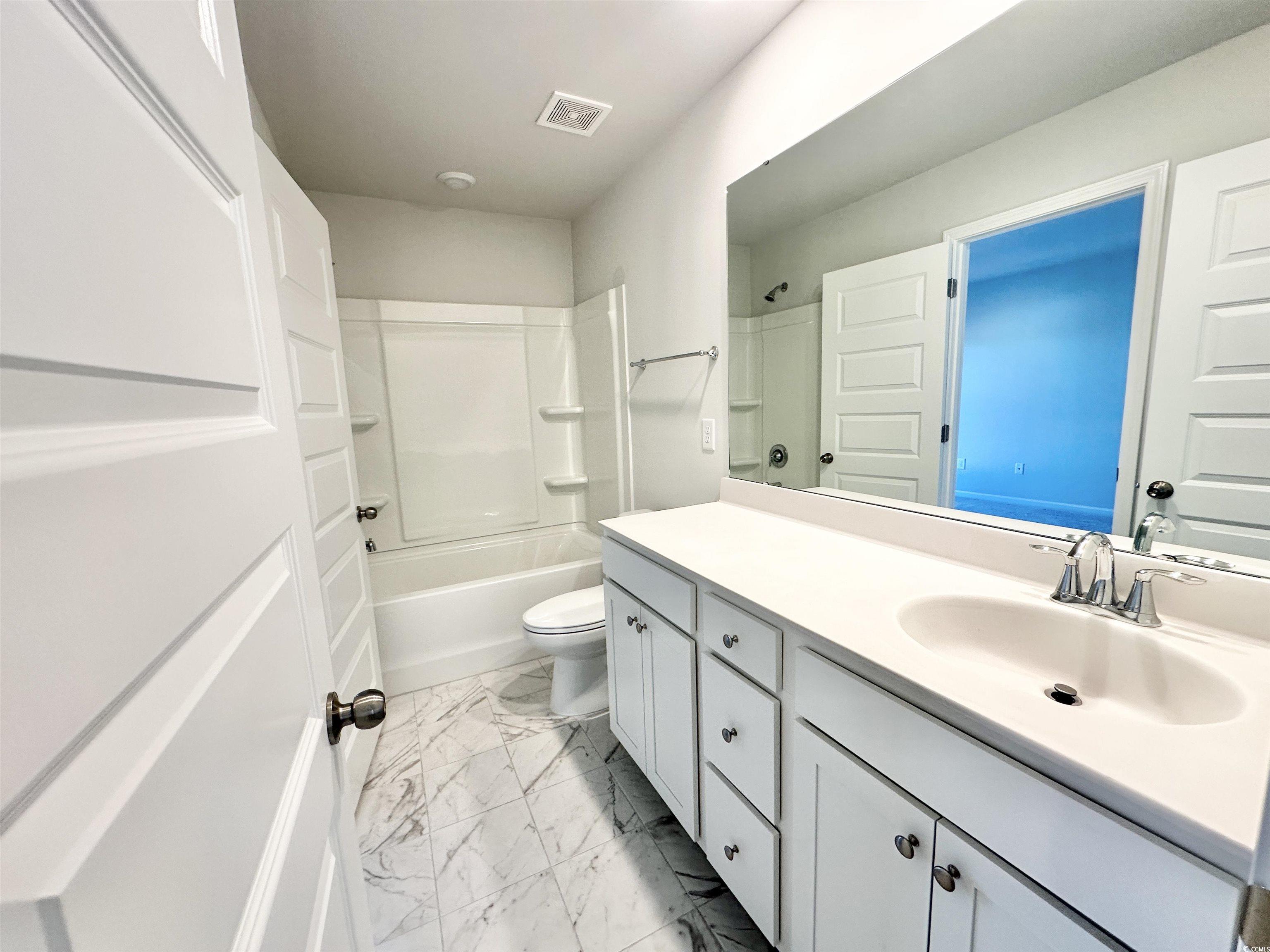 285 Augusta Grn Way Myrtle Beach, SC 29579 - Photo 21 of 28 Full bath featuring vanity, bathtub / shower combination, and light marble finish floors