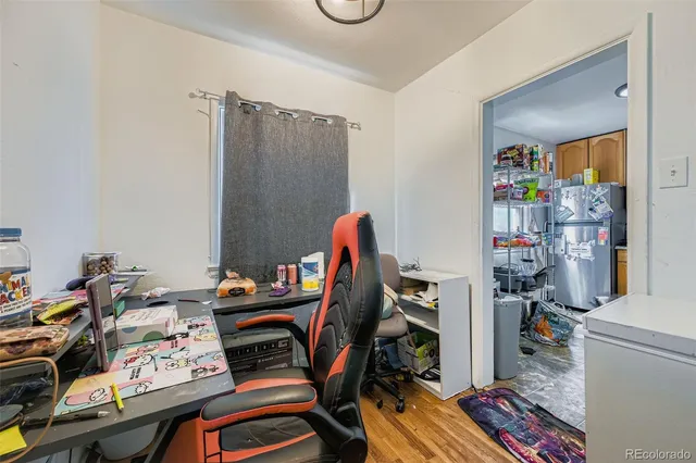 a view of a dining room with furniture and a window