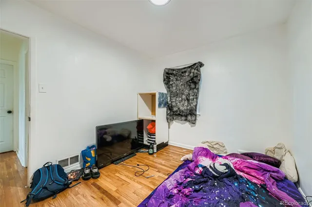 a bathroom with a sink mirror vanity and toilet