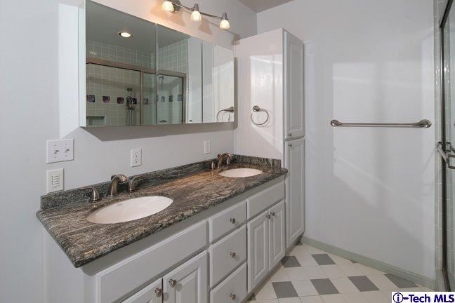 183 Marathon Road Altadena, CA 91001 - Photo 6 of 16 a bathroom with a granite countertop sink and a mirror