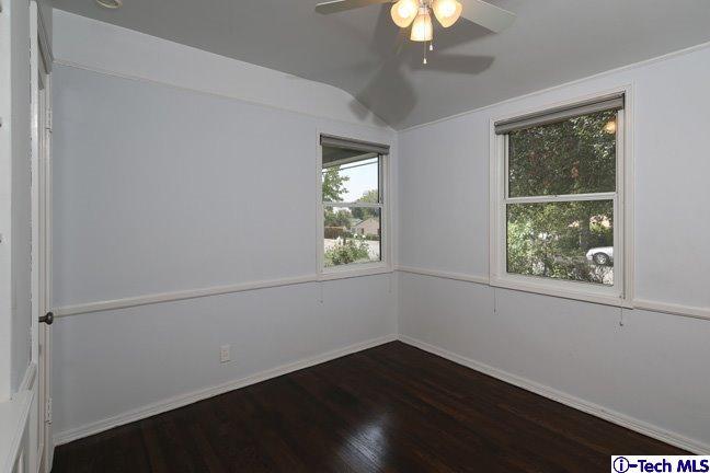 183 Marathon Road Altadena, CA 91001 - Photo 7 of 16 a view of an empty room with wooden floor and a window