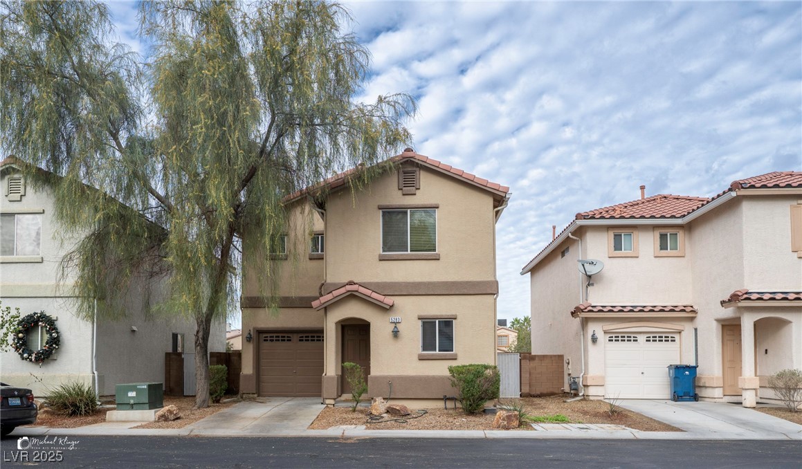 5283 Broadlake Lane Las Vegas, NV 89122 - Photo 2 of 36 Mediterranean / spanish home with stucco siding, an attached garage, and a tiled roof