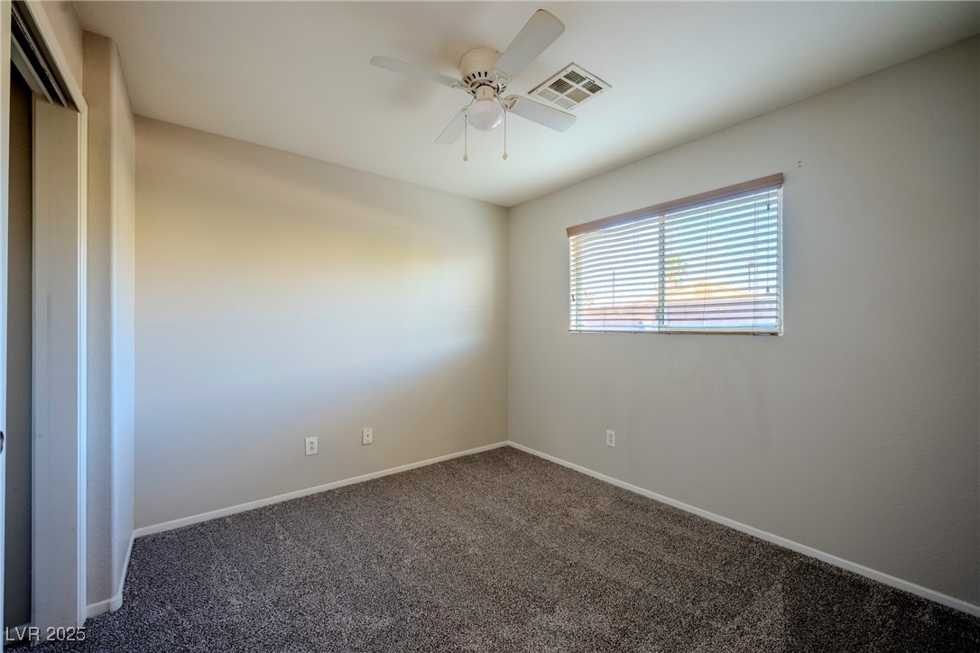 5283 Broadlake Lane Las Vegas, NV 89122 - Photo 25 of 36 Carpeted spare room featuring baseboards and ceiling fan