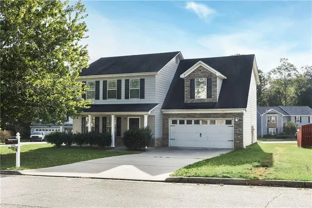 front view of a house with a yard