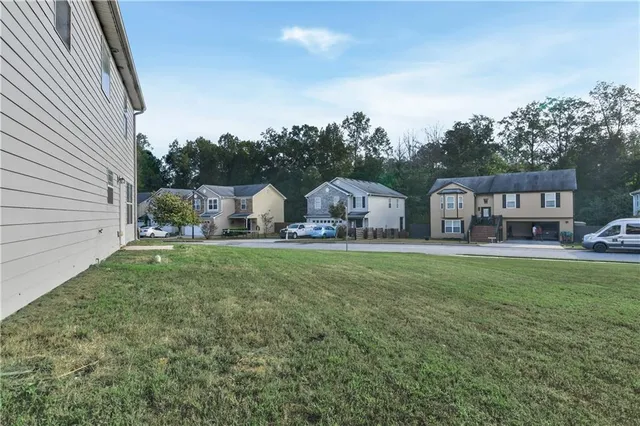 a view of house with garden and deck