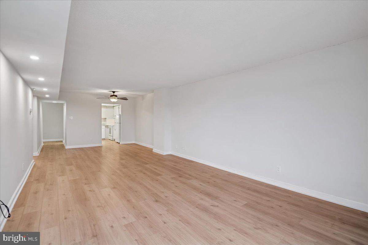 9200 Edwards Way, Unit 1202 Hyattsville, MD 20783 - Photo 11 of 34 a view of empty room with wooden floor