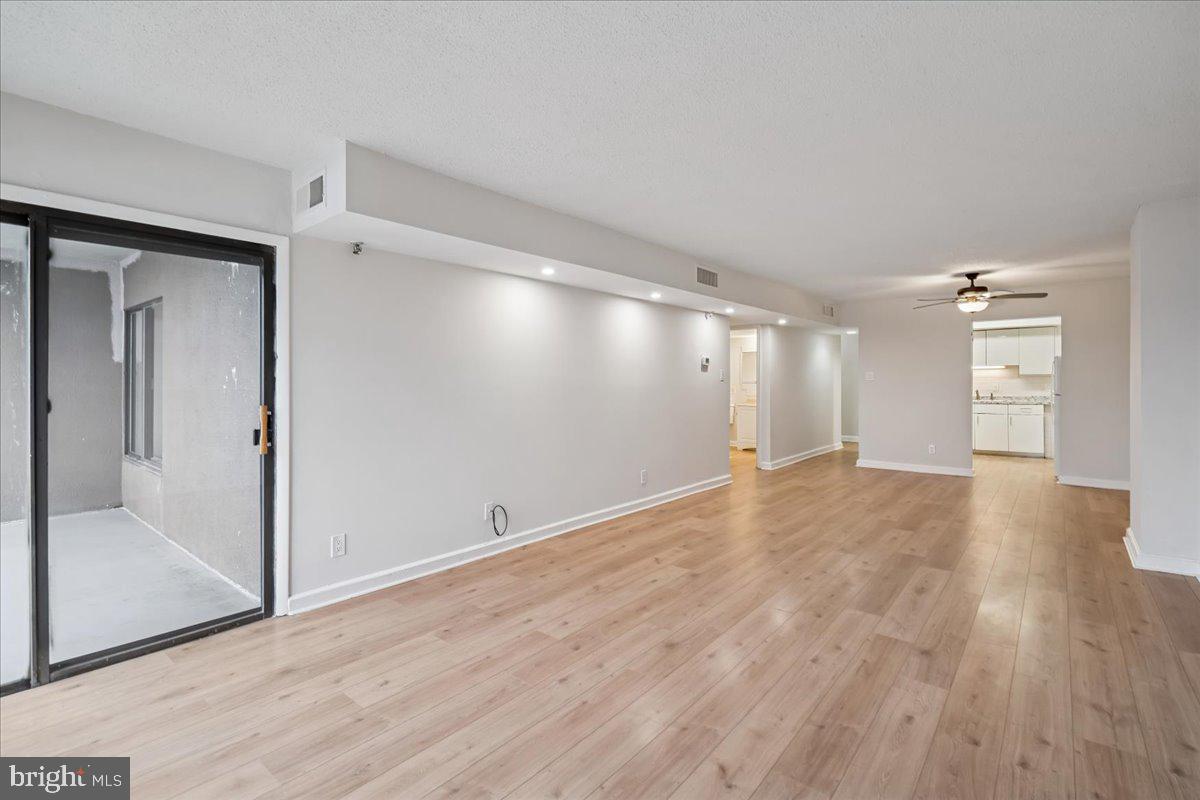 9200 Edwards Way, Unit 1202 Hyattsville, MD 20783 - Photo 12 of 34 a view of empty room with wooden floor