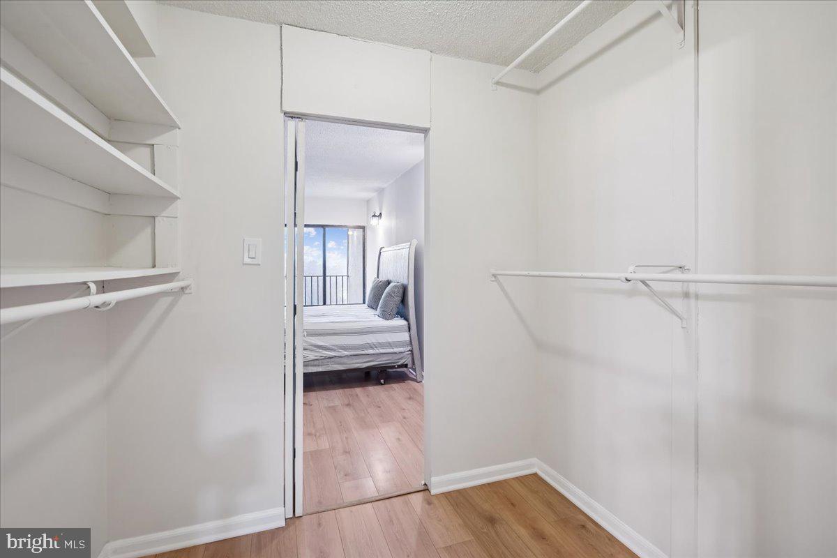 9200 Edwards Way, Unit 1202 Hyattsville, MD 20783 - Photo 15 of 34 a view of a bedroom from a hallway