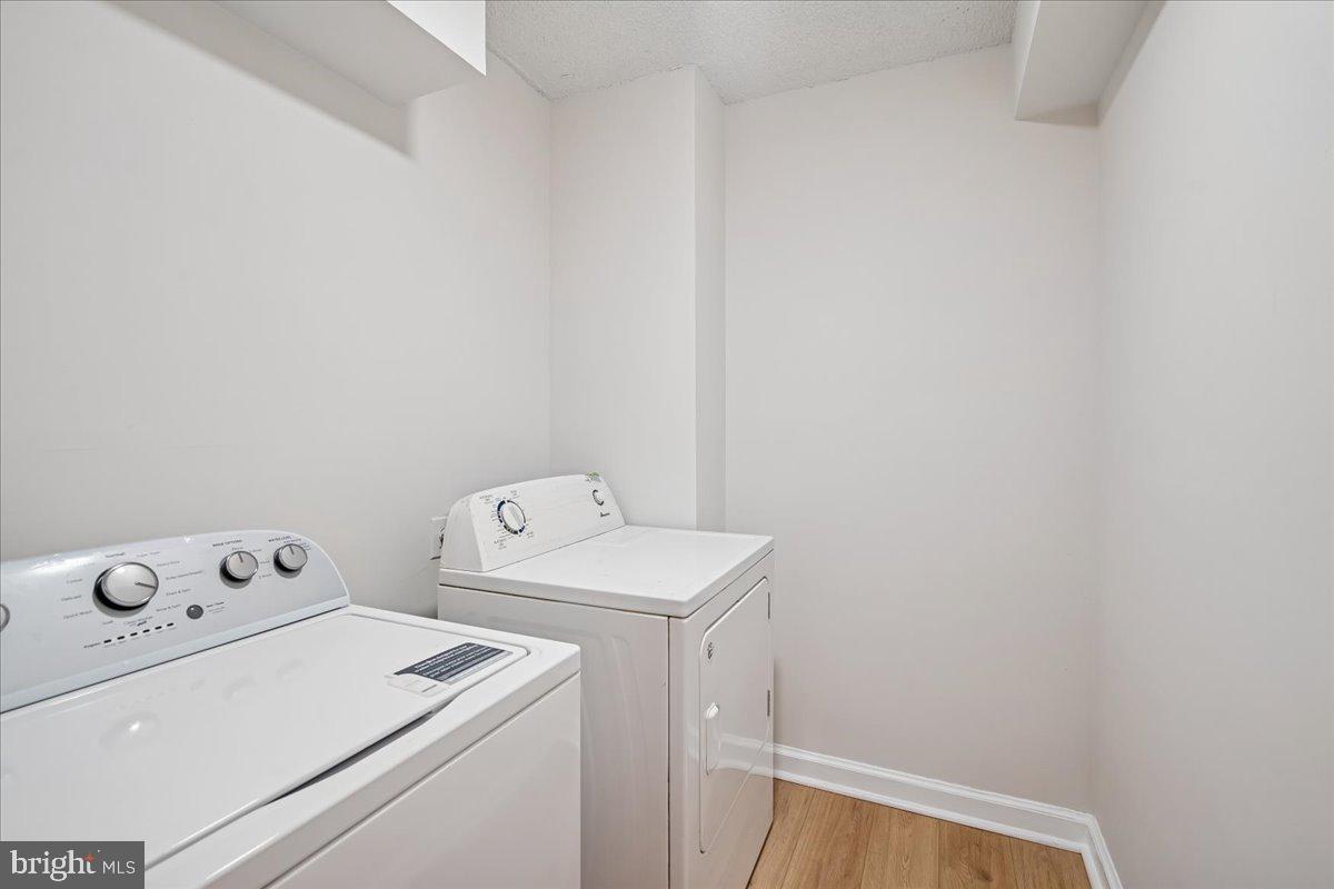 9200 Edwards Way, Unit 1202 Hyattsville, MD 20783 - Photo 17 of 34 a utility room with dryer and washer