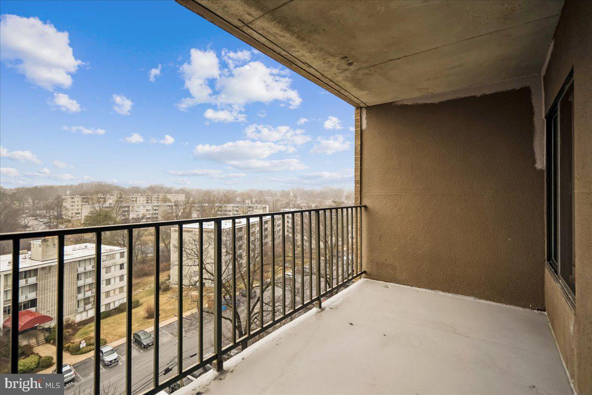 9200 Edwards Way, Unit 1202 Hyattsville, MD 20783 - Photo 18 of 34 a view of balcony with wooden floor