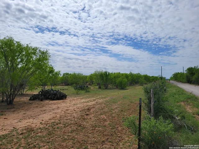 a view of a road with a yard