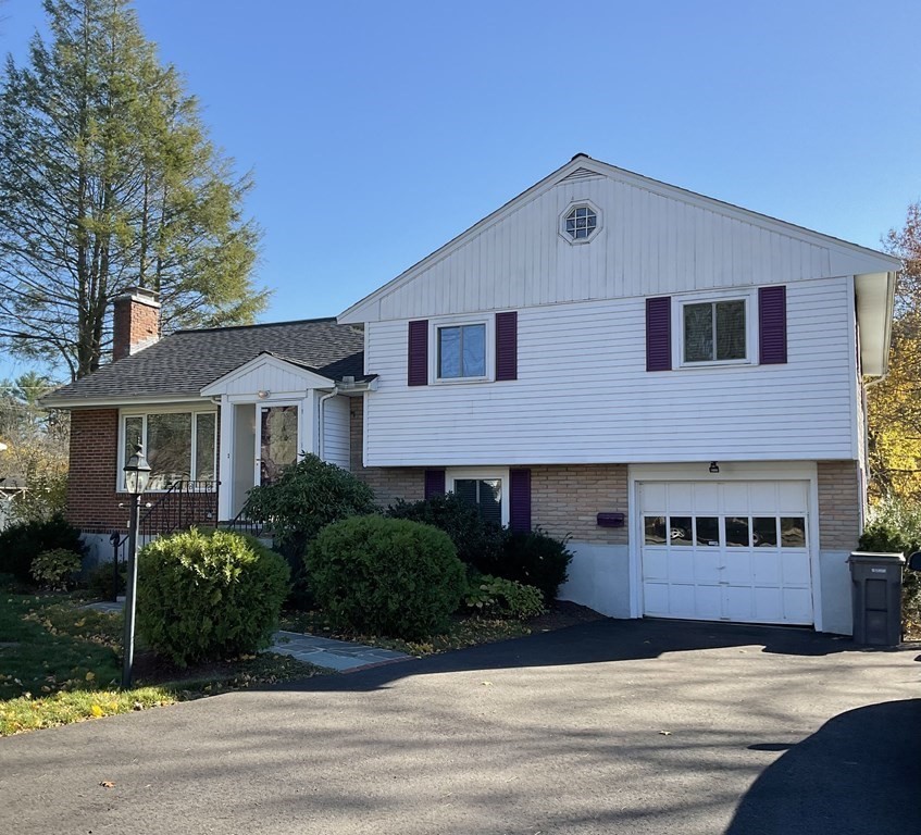 992 Pleasant Street Framingham, MA 01701 - Photo 1 of 29 a front view of a house with a yard