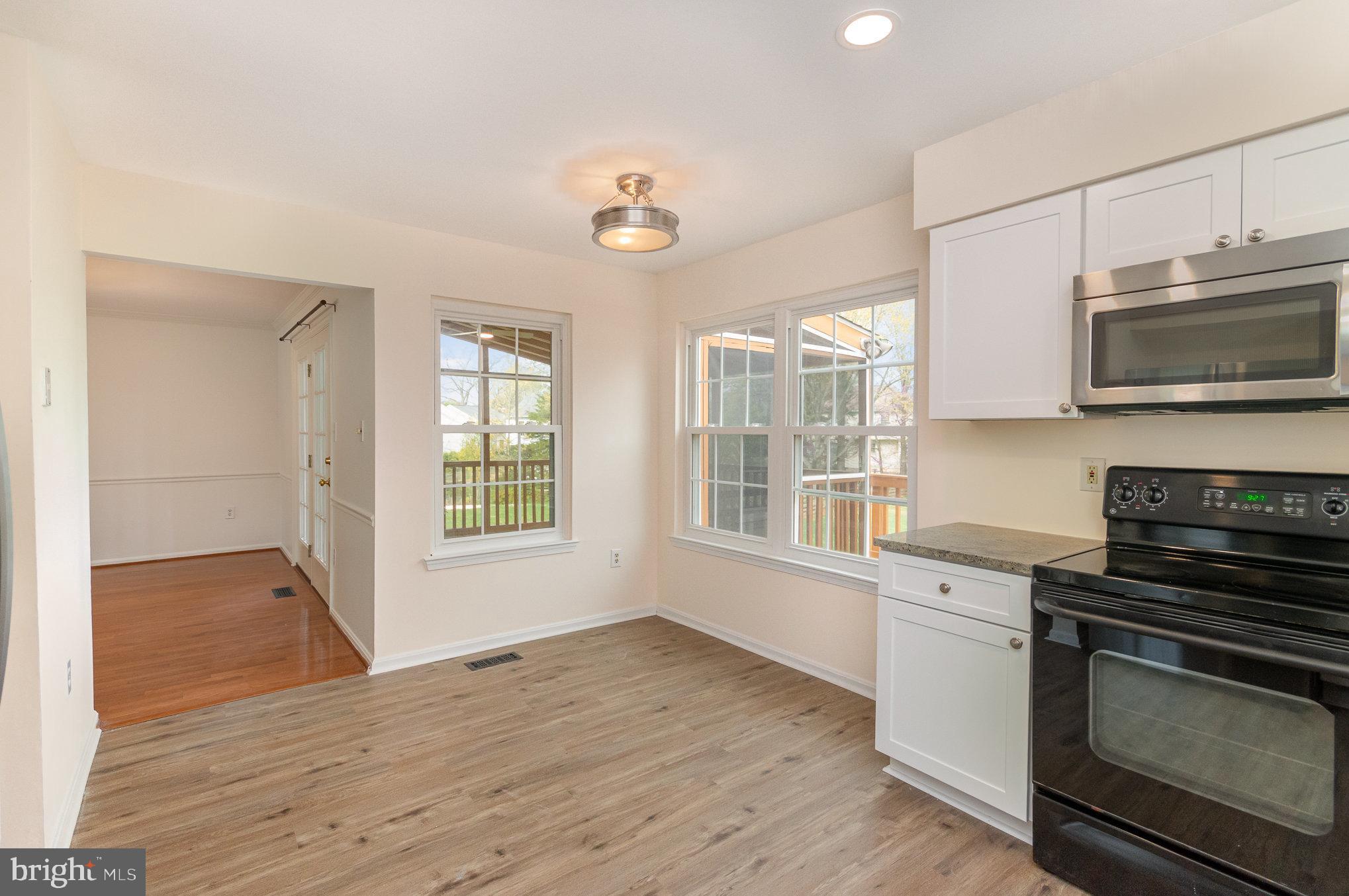2968 Emerald Chase Drive Herndon, VA 20171 - Photo 15 of 29 a kitchen with granite countertop wooden floors and stainless steel appliances