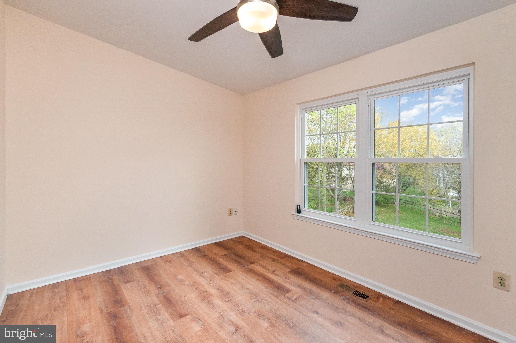 2968 Emerald Chase Drive Herndon, VA 20171 - Photo 19 of 29 a view of empty room with wooden floor and fan