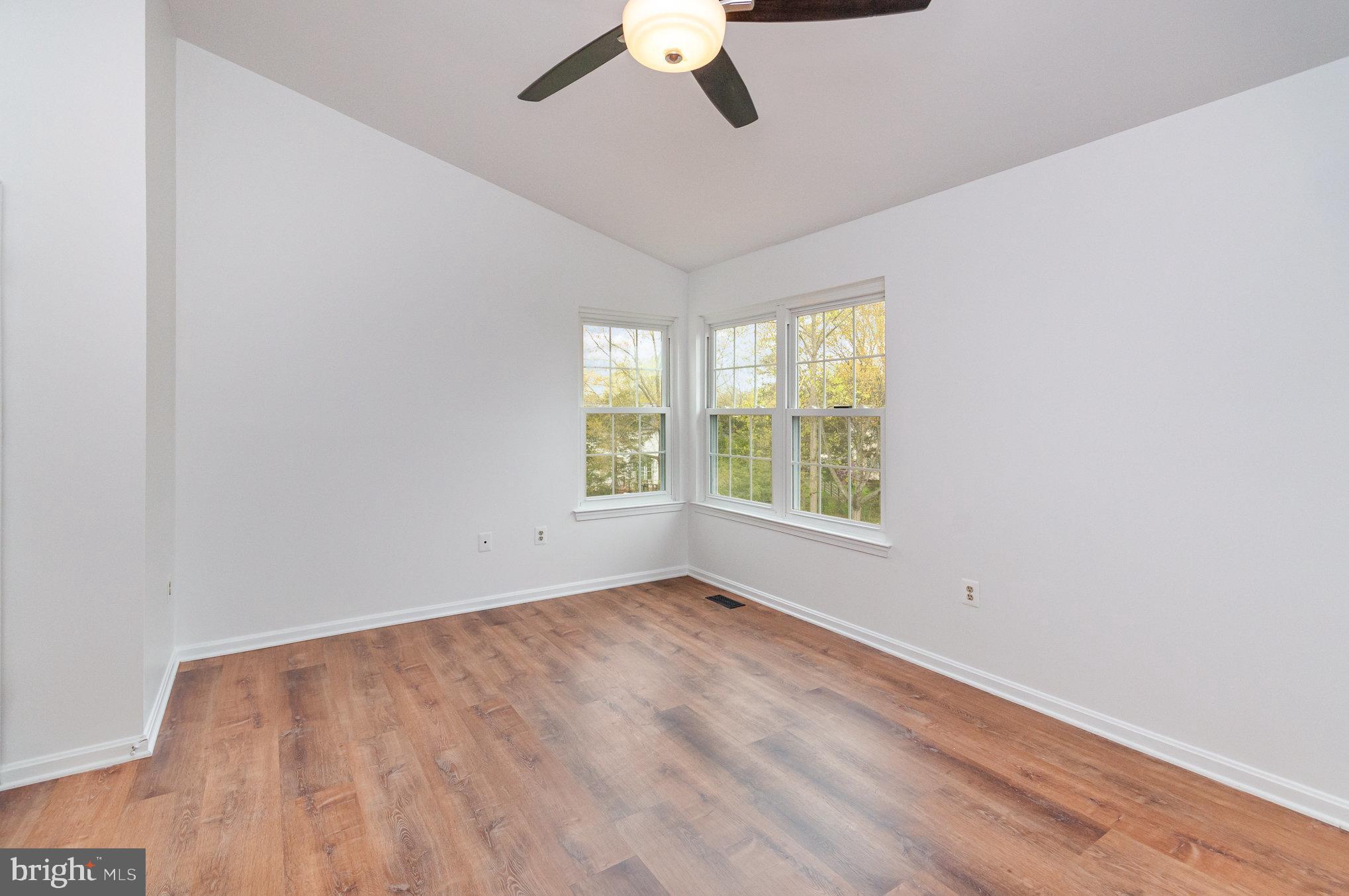 2968 Emerald Chase Drive Herndon, VA 20171 - Photo 20 of 29 an empty room with a window and a ceiling fan