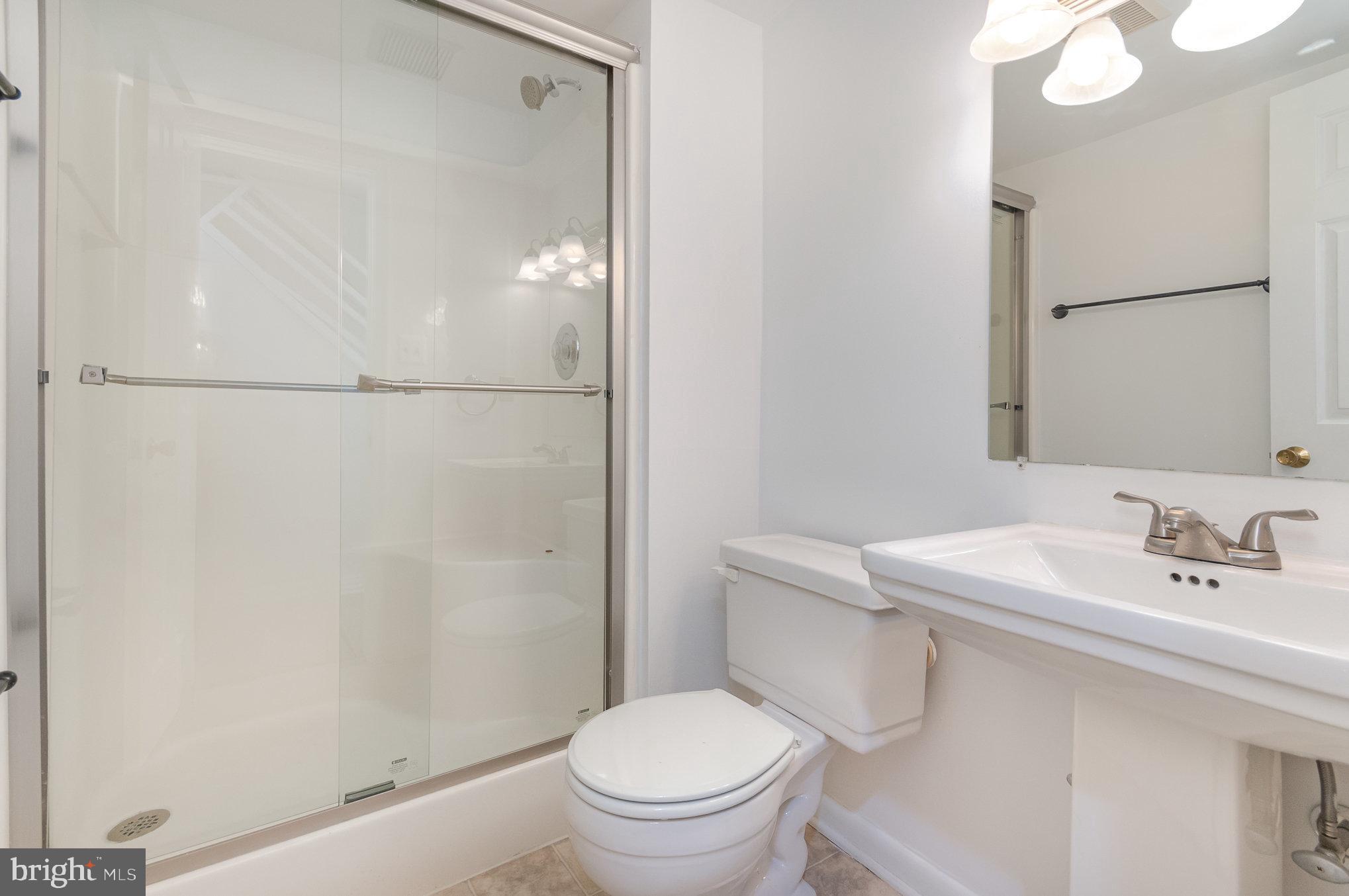 2968 Emerald Chase Drive Herndon, VA 20171 - Photo 22 of 29 a bathroom with a sink a toilet and shower