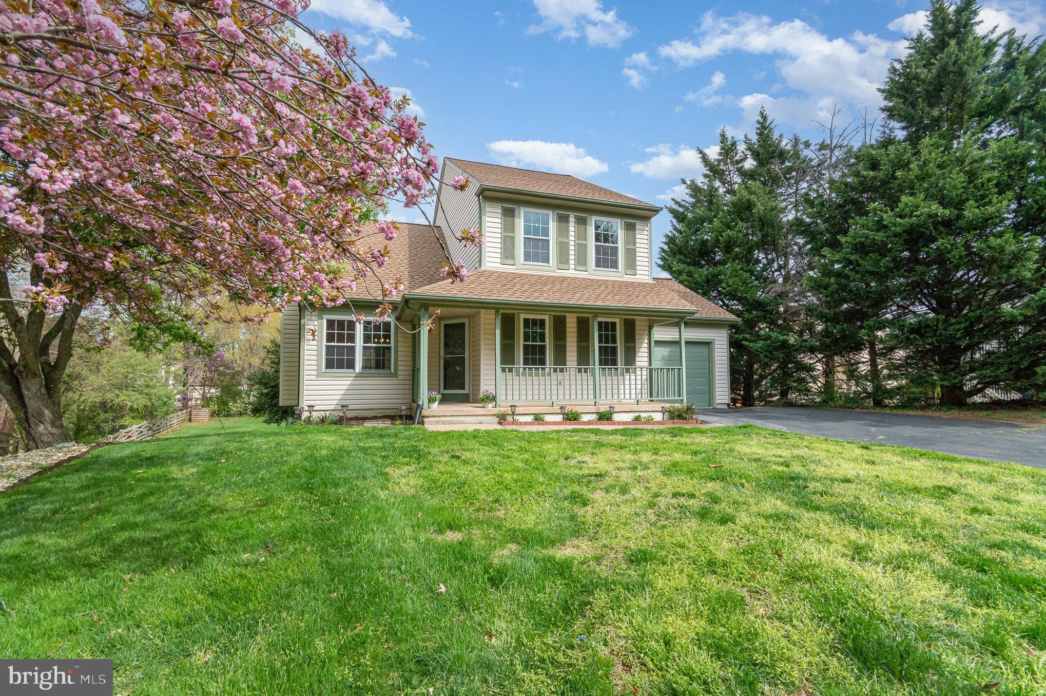 2968 Emerald Chase Drive Herndon, VA 20171 - Photo 5 of 29 a front view of a house with a garden