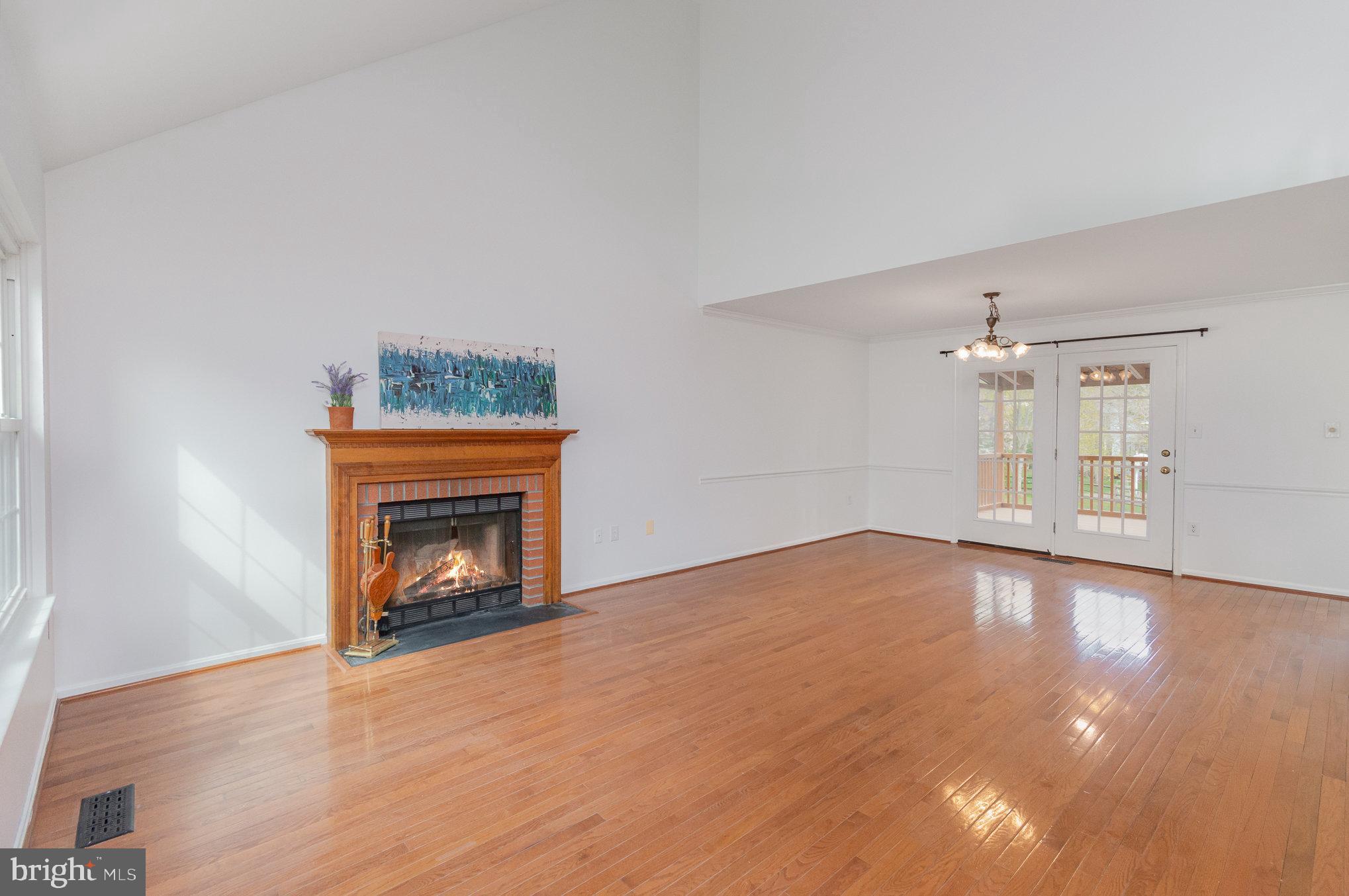 2968 Emerald Chase Drive Herndon, VA 20171 - Photo 10 of 29 an empty room with windows and fireplace