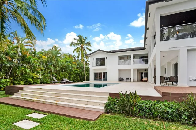 a aerial view of a house with a yard