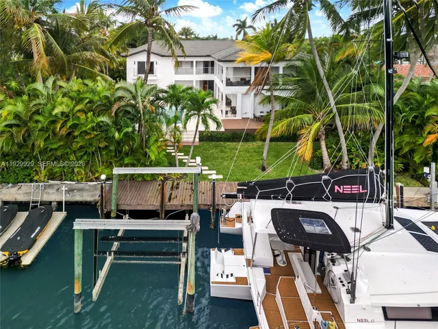 a view of a hallway with kitchen view and living room