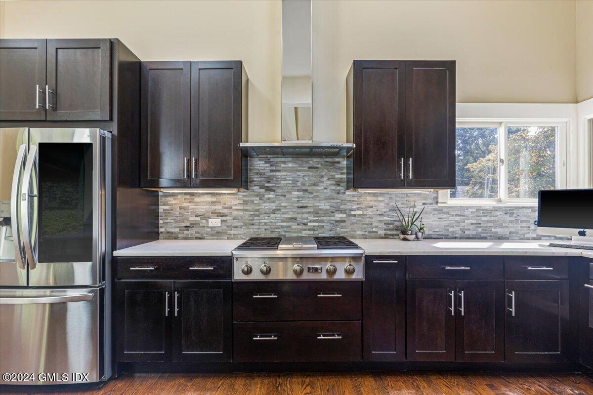 70 Gregory Road Cos Cob, CT 06807 - Photo 8 of 39 a kitchen with a sink and a refrigerator