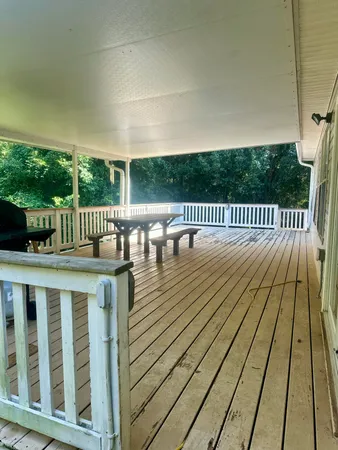 a view of balcony with wooden floor and outdoor space