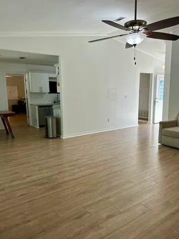 a view of kitchen and dining room with wooden floor