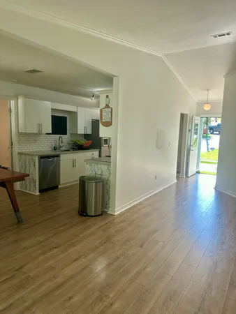 a kitchen with stainless steel appliances granite countertop a sink and a stove top oven
