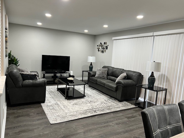 17 Wildwood Road Elk Grove Village, IL 60007 - Photo 2 of 11 a living room with furniture and a flat screen tv