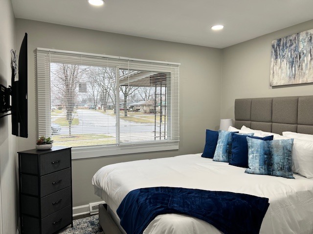 17 Wildwood Road Elk Grove Village, IL 60007 - Photo 6 of 11 a bedroom with a bed and window