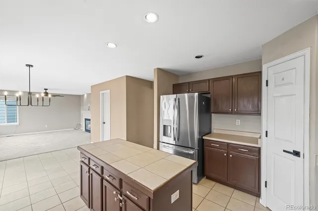 a view of storage and utility room with a window