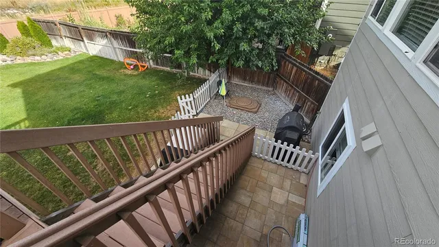a view of balcony with wooden floor