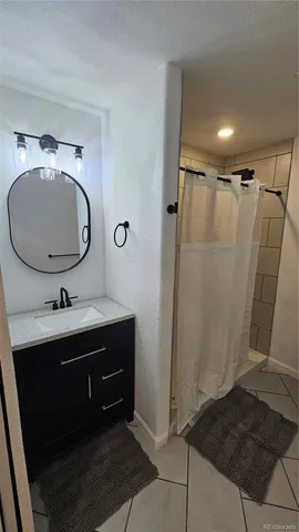 a bathroom with a sink and mirror