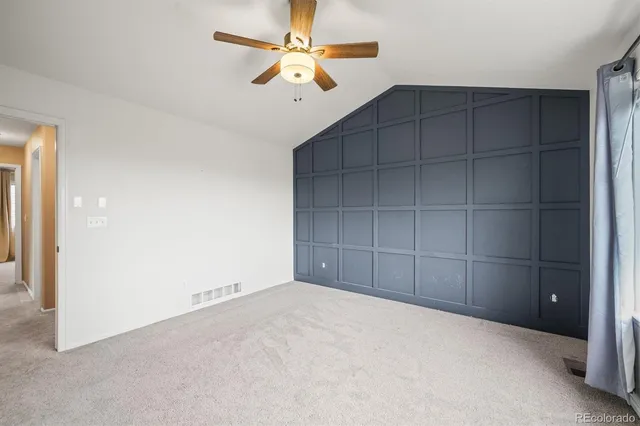 a front view of house with a garden