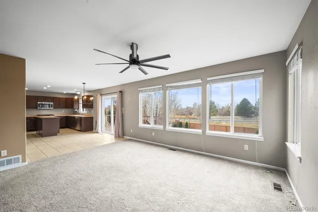 a view of an empty room with a fireplace